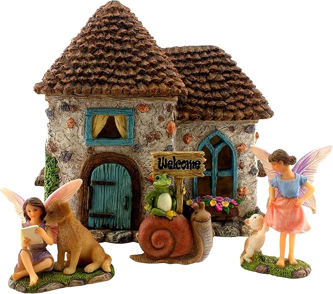 Fairy garden set with a small house, fairies, and animals on a white background