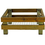 Wooden rabbit hutch with wire bottom on a white background