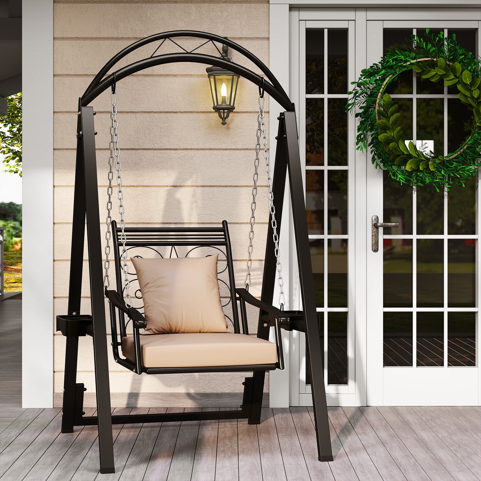 Decorative outdoor swing with beige cushion on a wooden deck, featuring a wreath on a door in the background.
