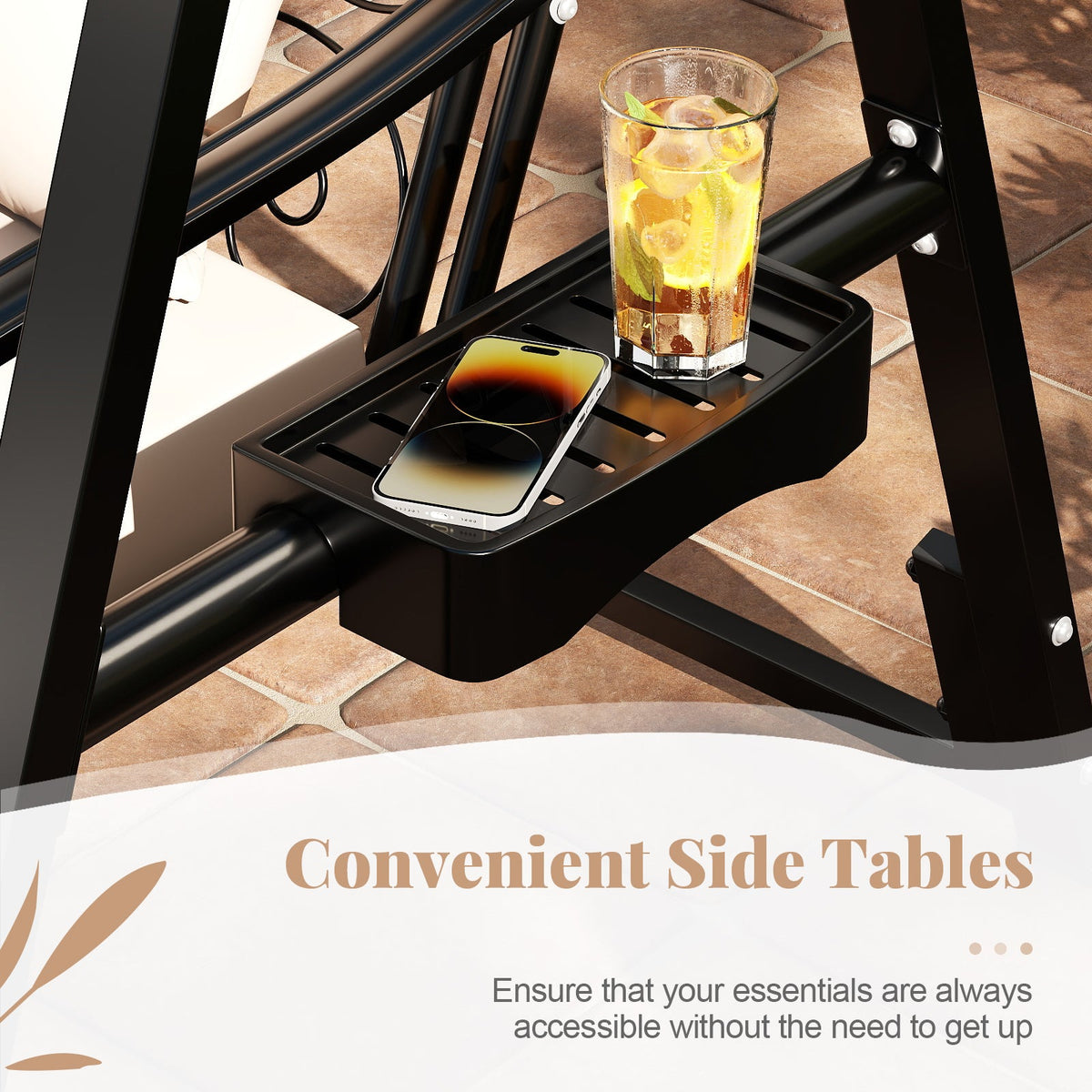 Black side table attached to a chair with a glass and phone on it, on a patio.