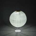 White paper lantern with solar light on a black background