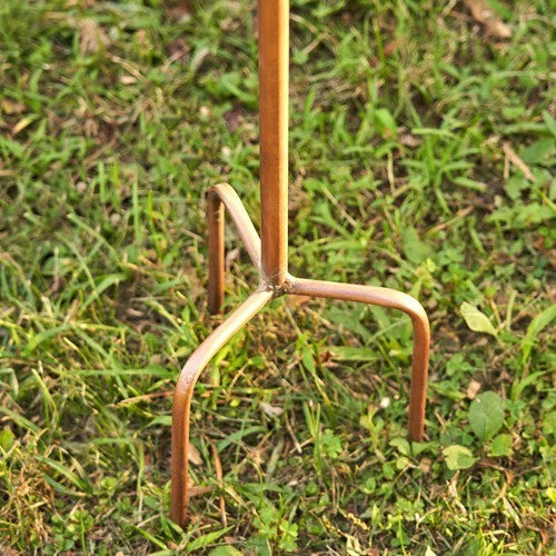 Rustic metal garden fork on grass