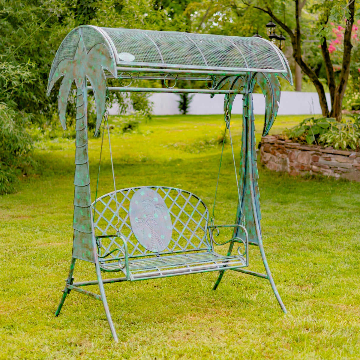 Metal garden swing with canopy in a grassy outdoor setting