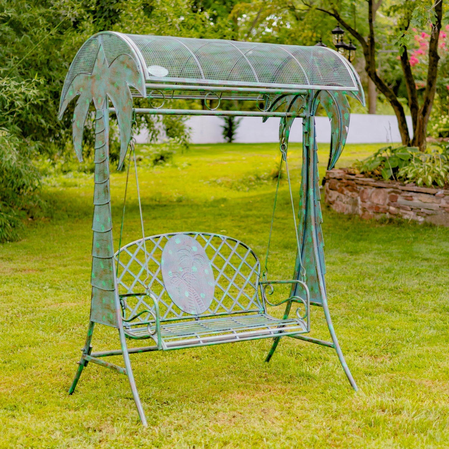 Metal garden swing with canopy in a grassy outdoor setting