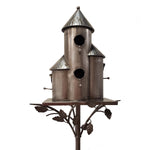 Decorative metal birdhouse with multiple cylindrical sections on a white background