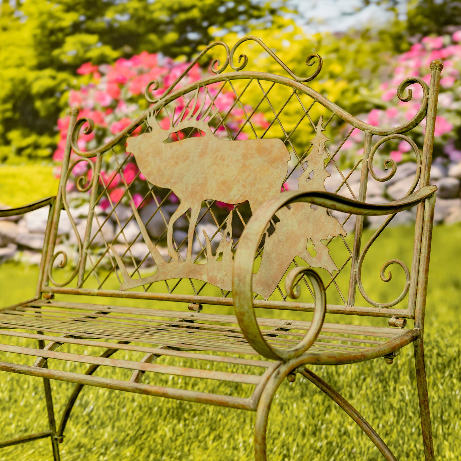 Decorative metal bench with deer design in a garden setting