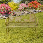 Decorative metal bench with animal cutouts in a garden setting