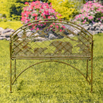Decorative metal bench with animal cutouts in a garden setting