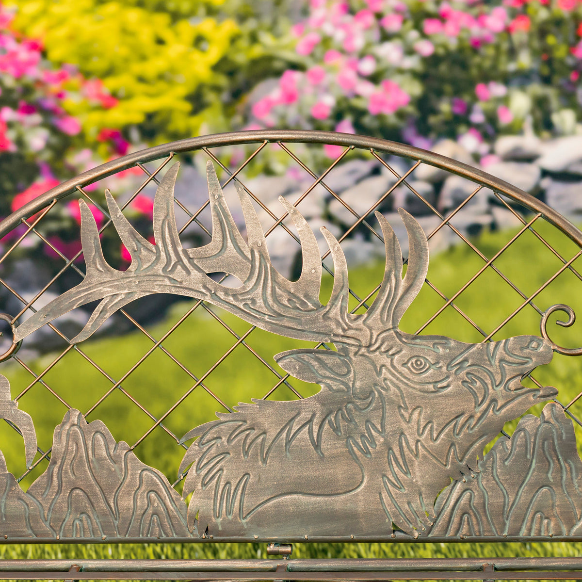 Metallic deer sculpture with floral background