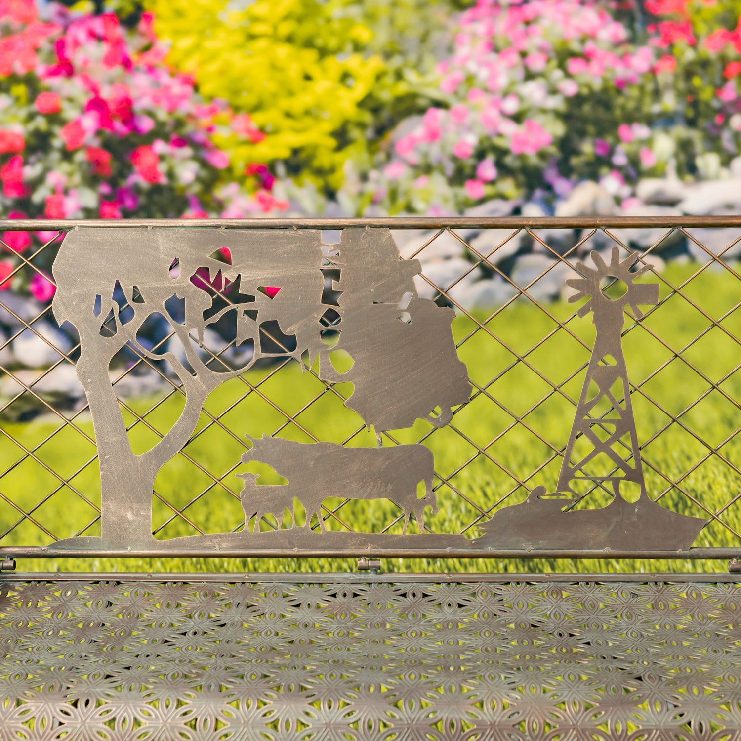 Metallic garden bench with animal cutouts against a floral background