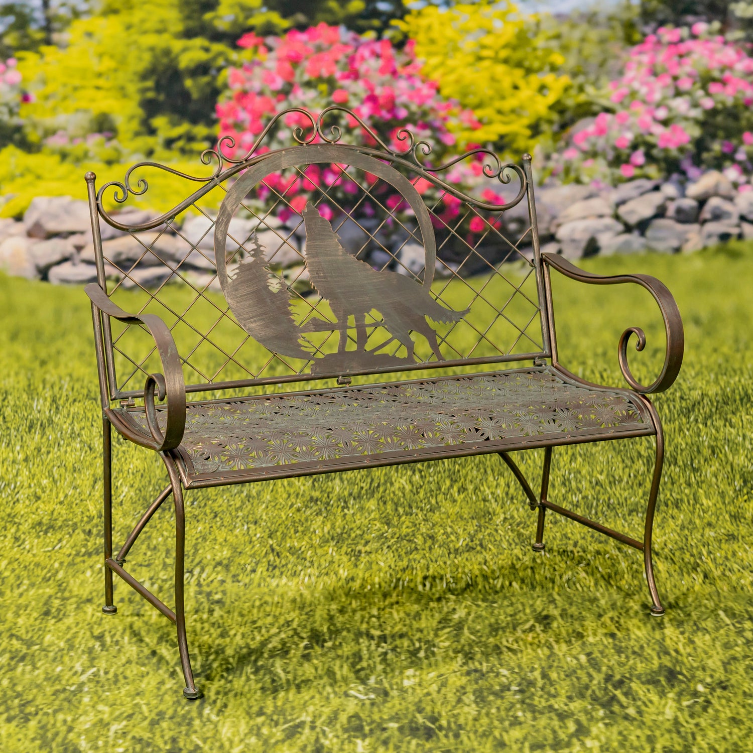 Decorative metal bench with peacock design in a garden setting