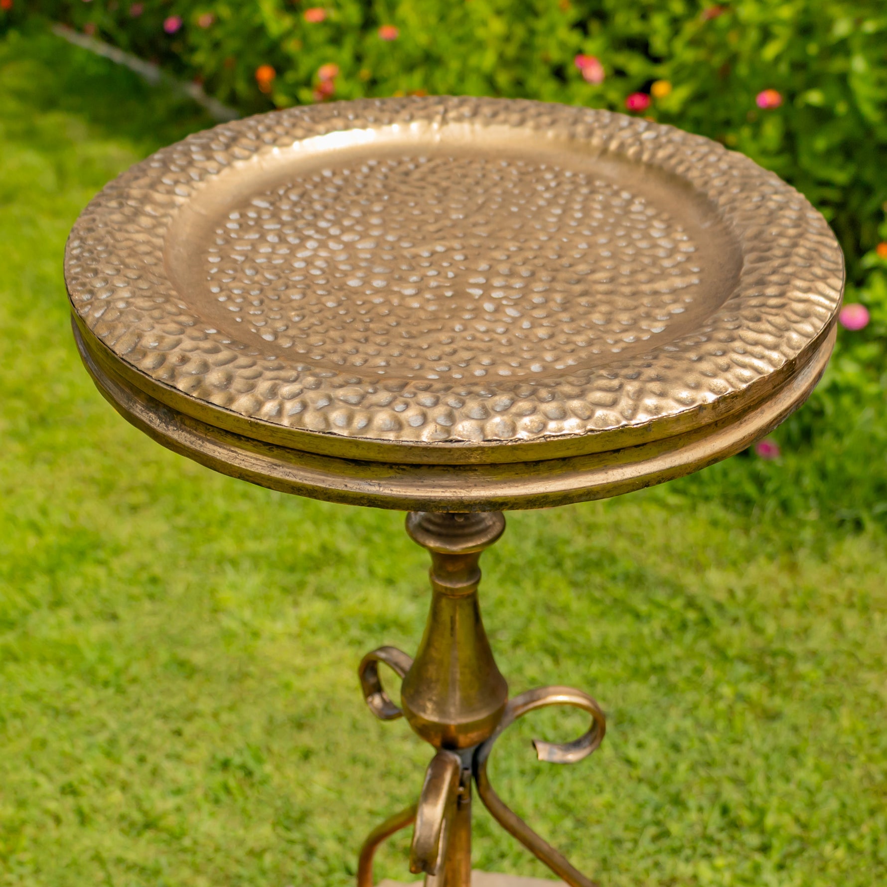 Dark gold bird feeder plate on a pedestal