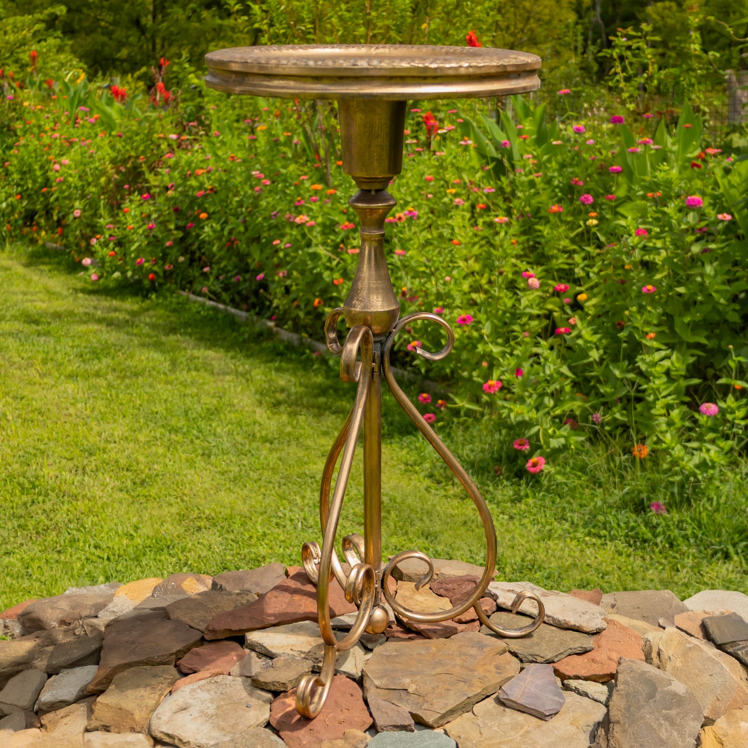 Dark gold bird feeder plate on a pedestal