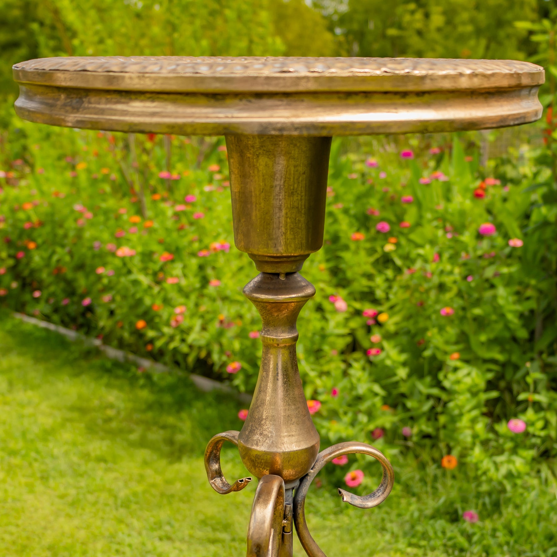Dark gold bird feeder plate on a pedestal