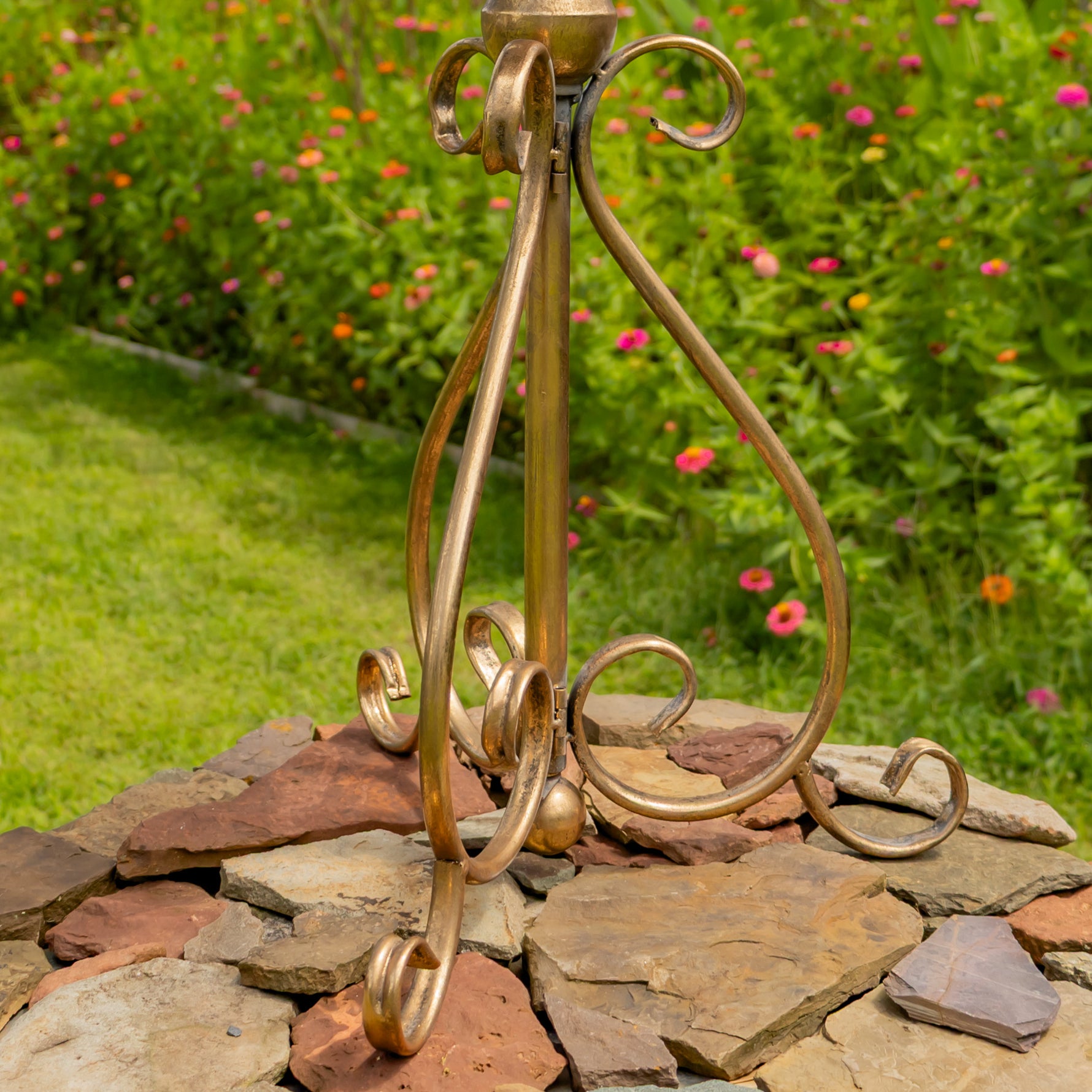 Dark gold bird feeder plate on a pedestal