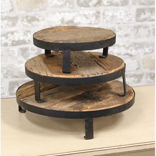 Three-tiered wooden stand with metal legs on a neutral background