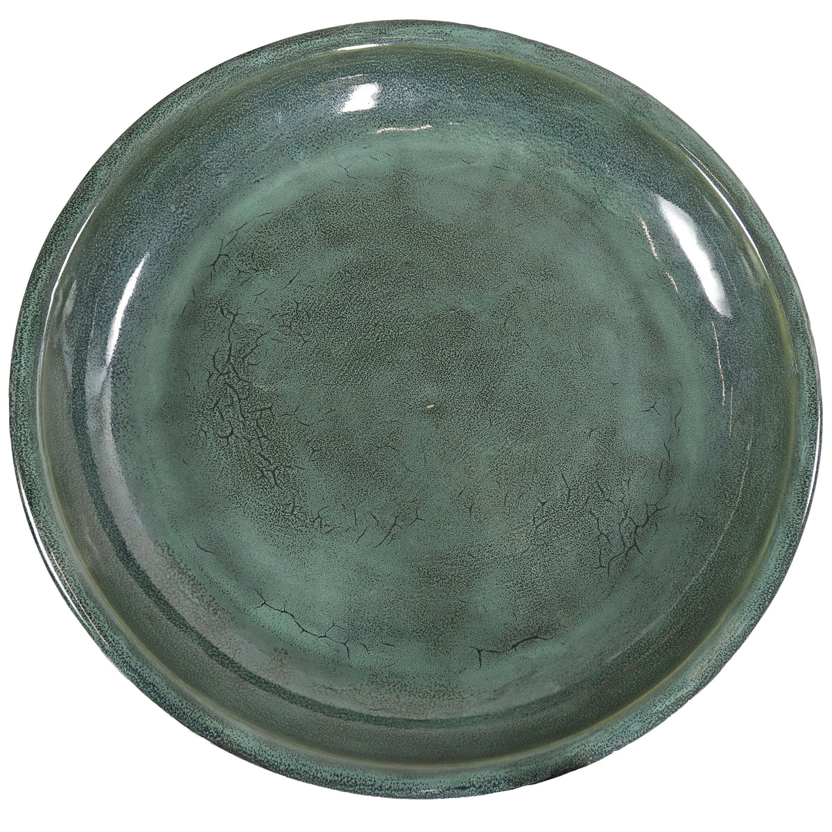 Green ceramic plate on a white background